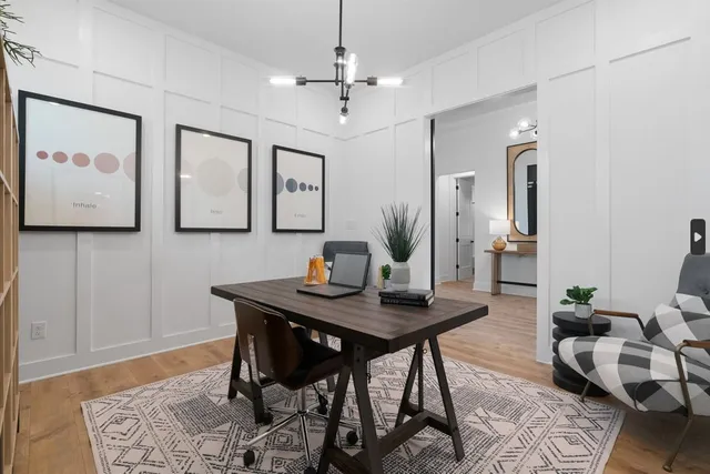 a view of a hallway with furniture