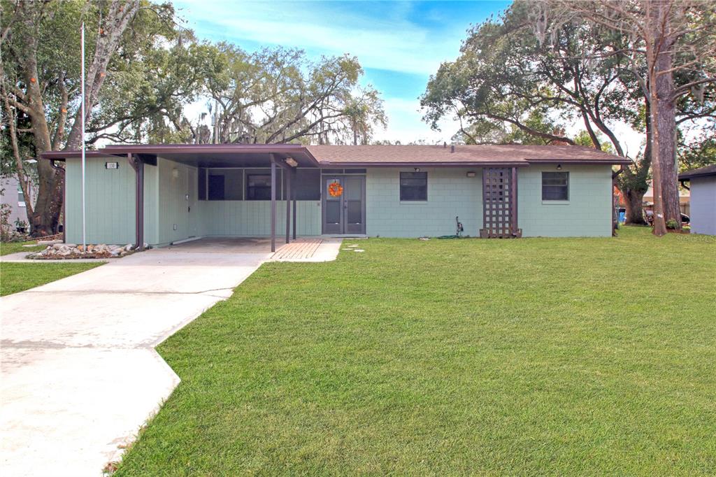 a house that has a tree in front of it