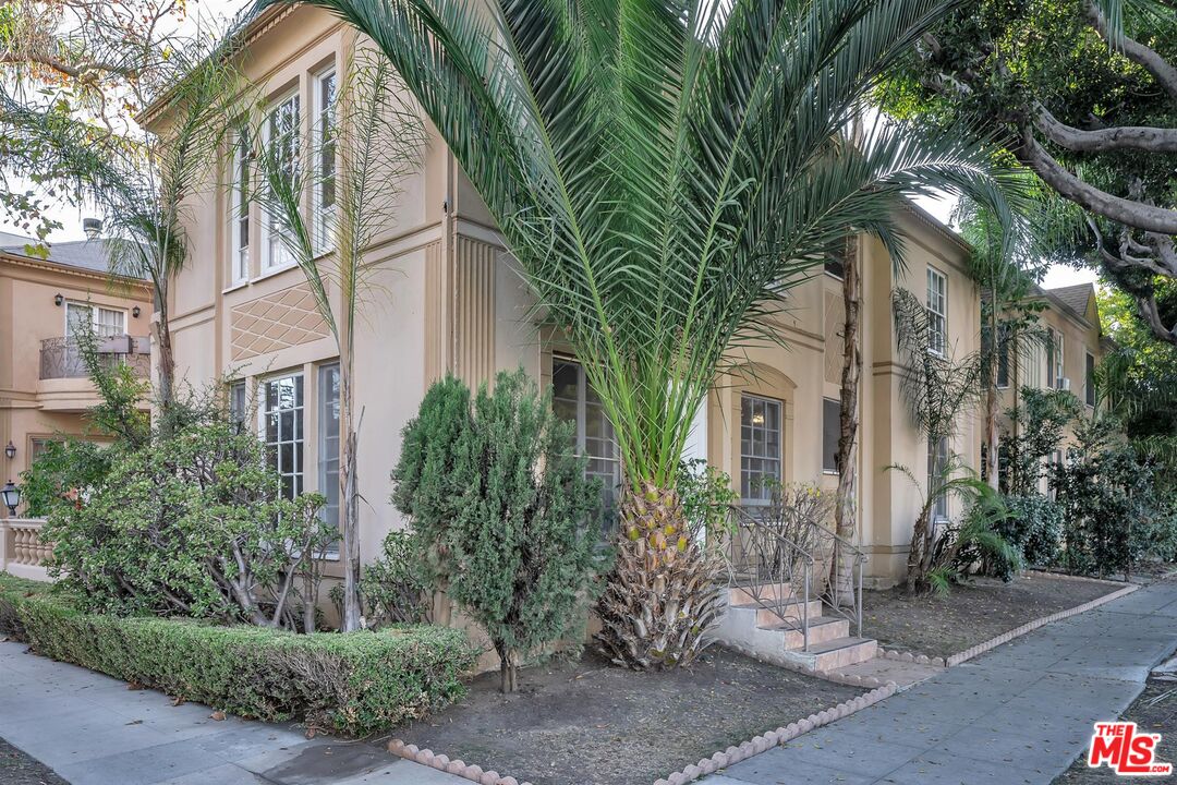 9000 Burton Way Beverly Hills, CA 90211 - Photo 2 of 26 a view of a house with a tree