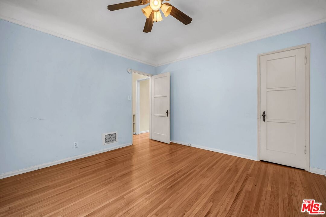 9000 Burton Way Beverly Hills, CA 90211 - Photo 19 of 26 wooden floor in an empty room