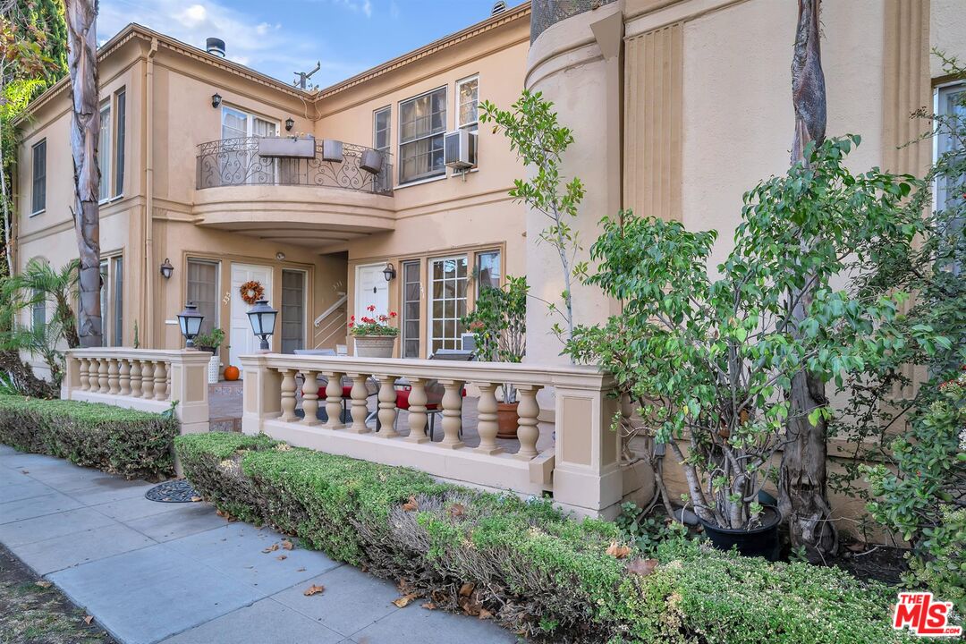9000 Burton Way Beverly Hills, CA 90211 - Photo 3 of 26 a view of house with outdoor space and porch