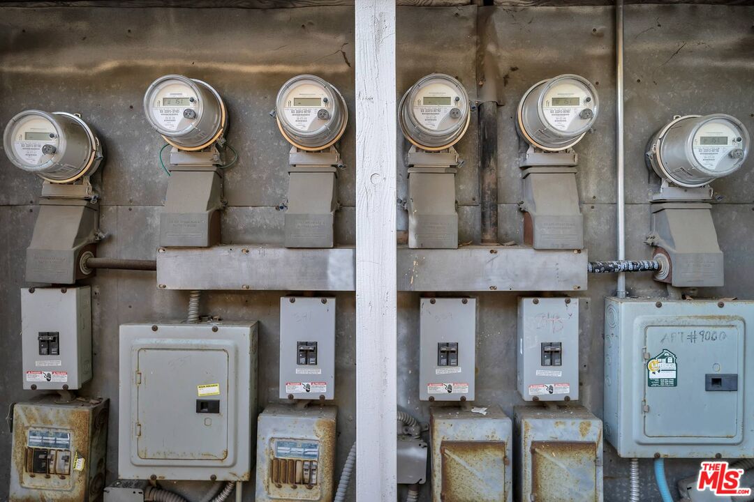 9000 Burton Way Beverly Hills, CA 90211 - Photo 23 of 26 a group of wall clock on a wall