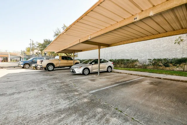 a view of parking space with parked cars