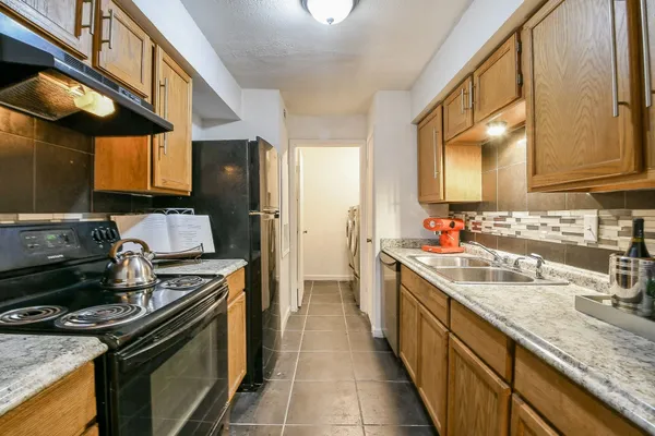 a kitchen with a stove and a sink