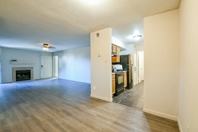 a view of a kitchen with a sink and a stove