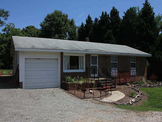 4812 Tryon Road Raleigh, NC 27606 - Photo 2 of 12 a view of a house with a patio