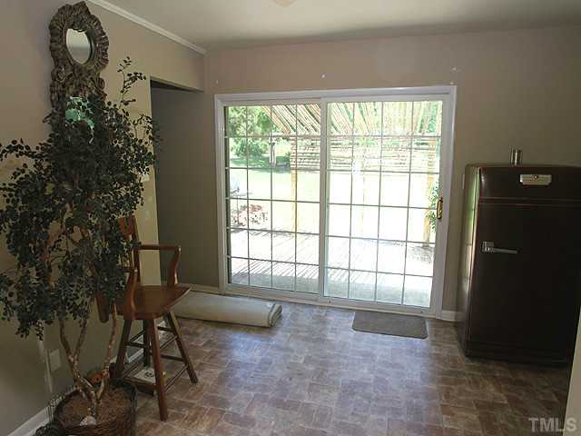 4812 Tryon Road Raleigh, NC 27606 - Photo 6 of 12 a living room with furniture and a window