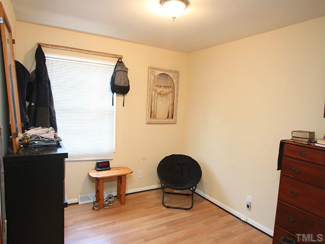 4812 Tryon Road Raleigh, NC 27606 - Photo 9 of 12 a living room with furniture and a potted plant