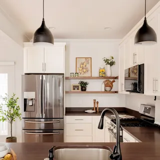 a kitchen with a refrigerator and a sink