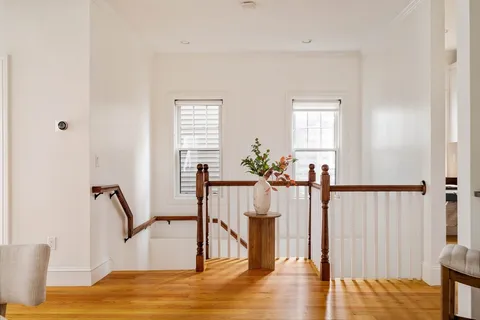 a view of hall with wooden floor