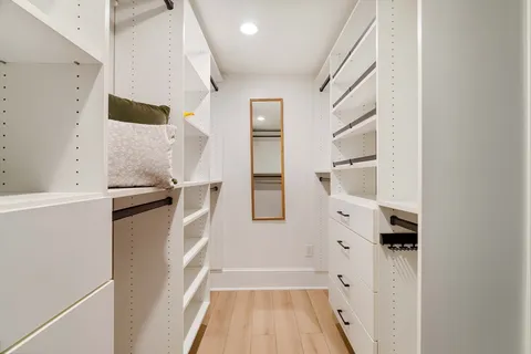 a kitchen with a refrigerator and a refrigerator