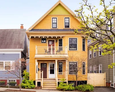 a front view of residential houses with street
