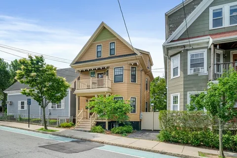 front view of a house with a garden