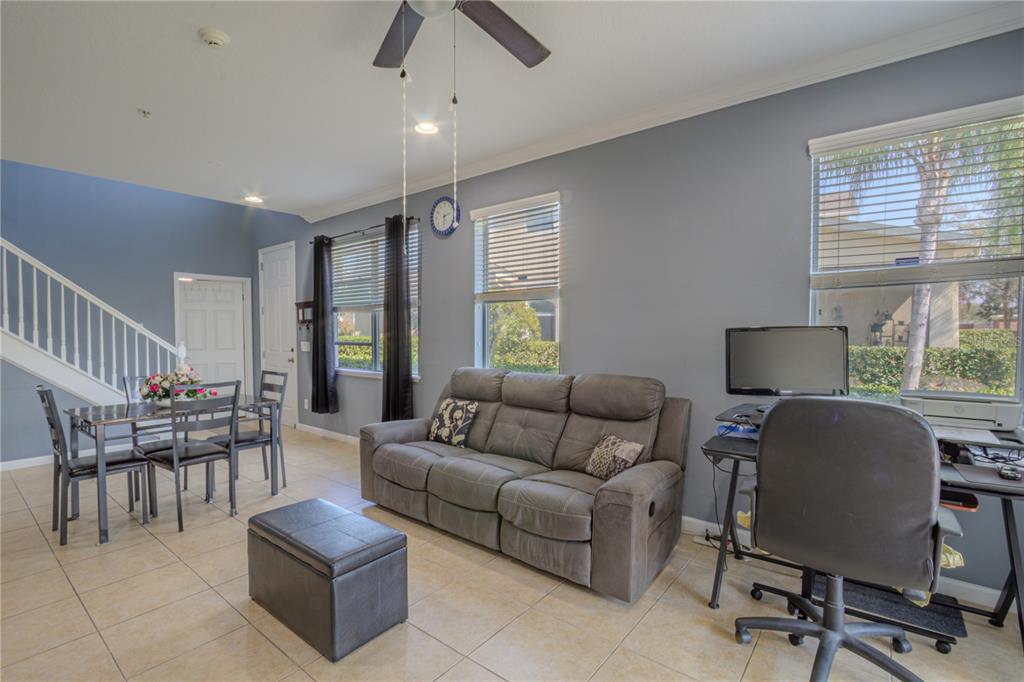 762 Terrace Spring Drive Orlando, FL 32828 - Photo 11 of 26 a living room with furniture and a window