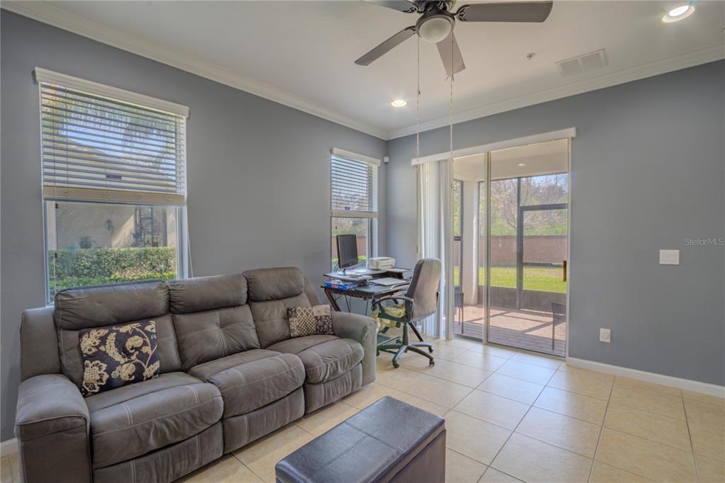 762 Terrace Spring Drive Orlando, FL 32828 - Photo 12 of 26 a living room with furniture and a window