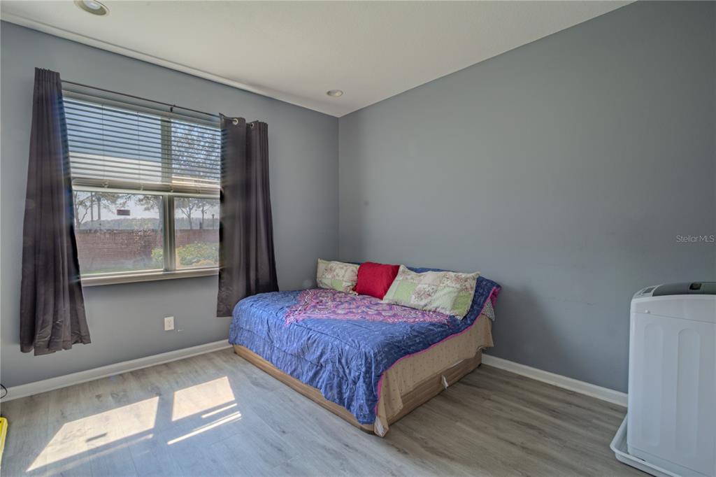 762 Terrace Spring Drive Orlando, FL 32828 - Photo 15 of 26 a bedroom with a bed and window