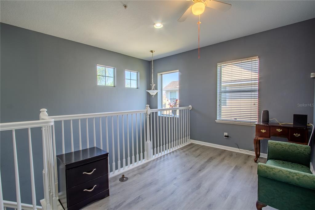 762 Terrace Spring Drive Orlando, FL 32828 - Photo 17 of 26 a living room with furniture and wooden floor