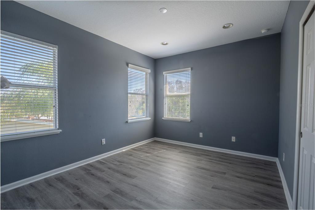 762 Terrace Spring Drive Orlando, FL 32828 - Photo 18 of 26 a view of room window and wooden floor