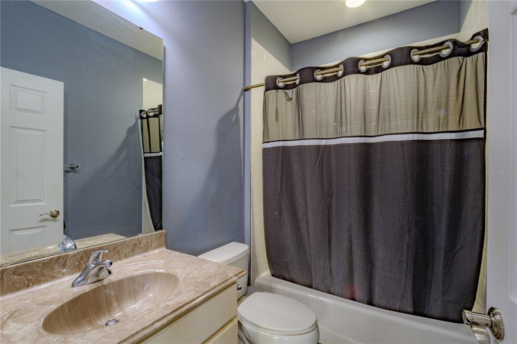 762 Terrace Spring Drive Orlando, FL 32828 - Photo 20 of 26 a bathroom with a sink toilet and shower