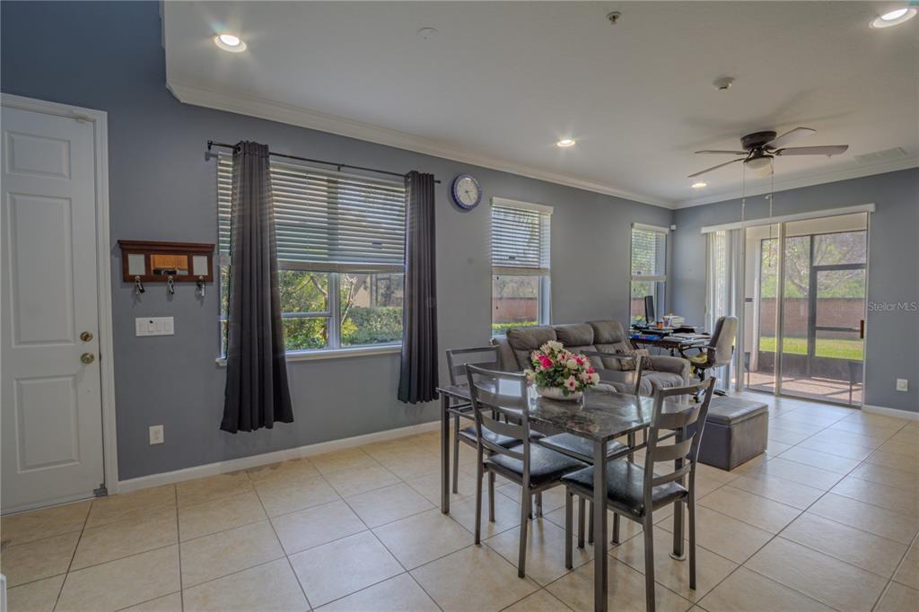 762 Terrace Spring Drive Orlando, FL 32828 - Photo 6 of 26 a view of a dining room with furniture and window