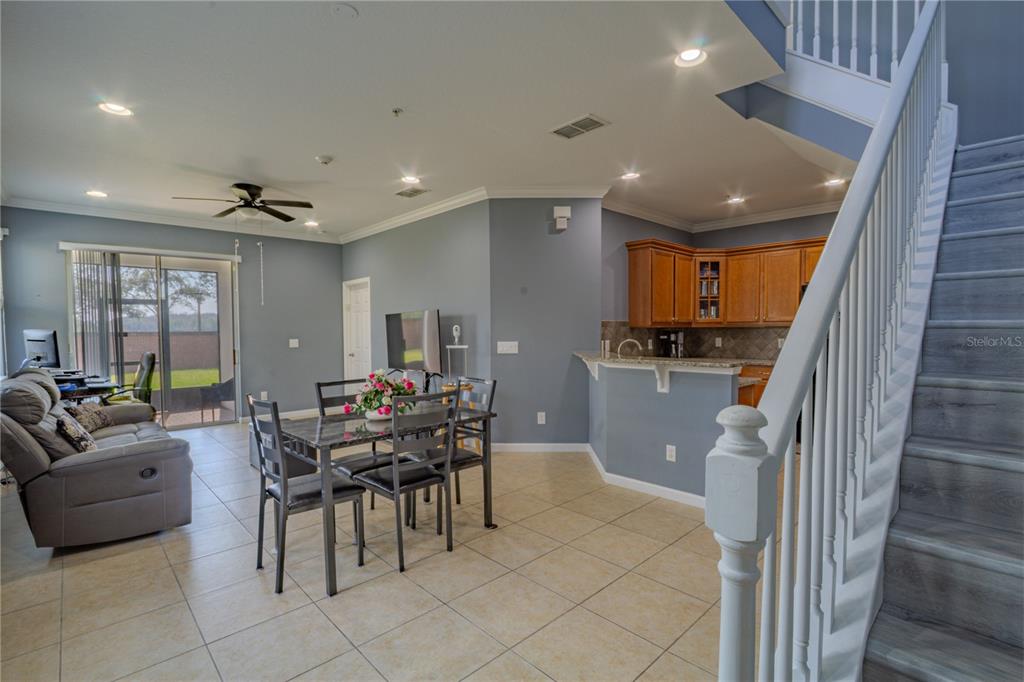 762 Terrace Spring Drive Orlando, FL 32828 - Photo 7 of 26 a view of a dining room with furniture