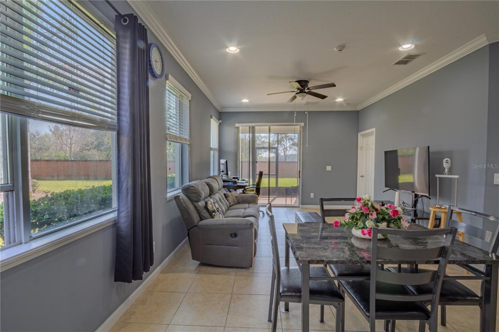 762 Terrace Spring Drive Orlando, FL 32828 - Photo 9 of 26 a view of a dining room with furniture window and outside view