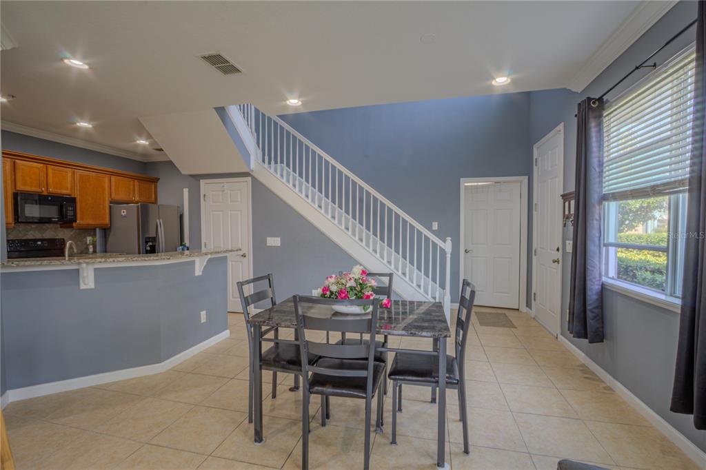 762 Terrace Spring Drive Orlando, FL 32828 - Photo 10 of 26 a dining room with furniture and entryway