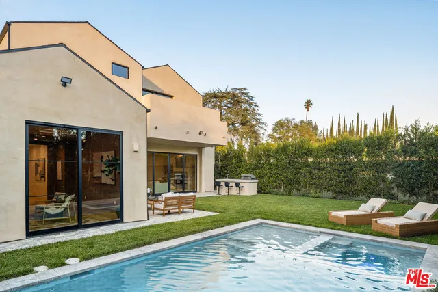 a front view of house with yard and outdoor seating