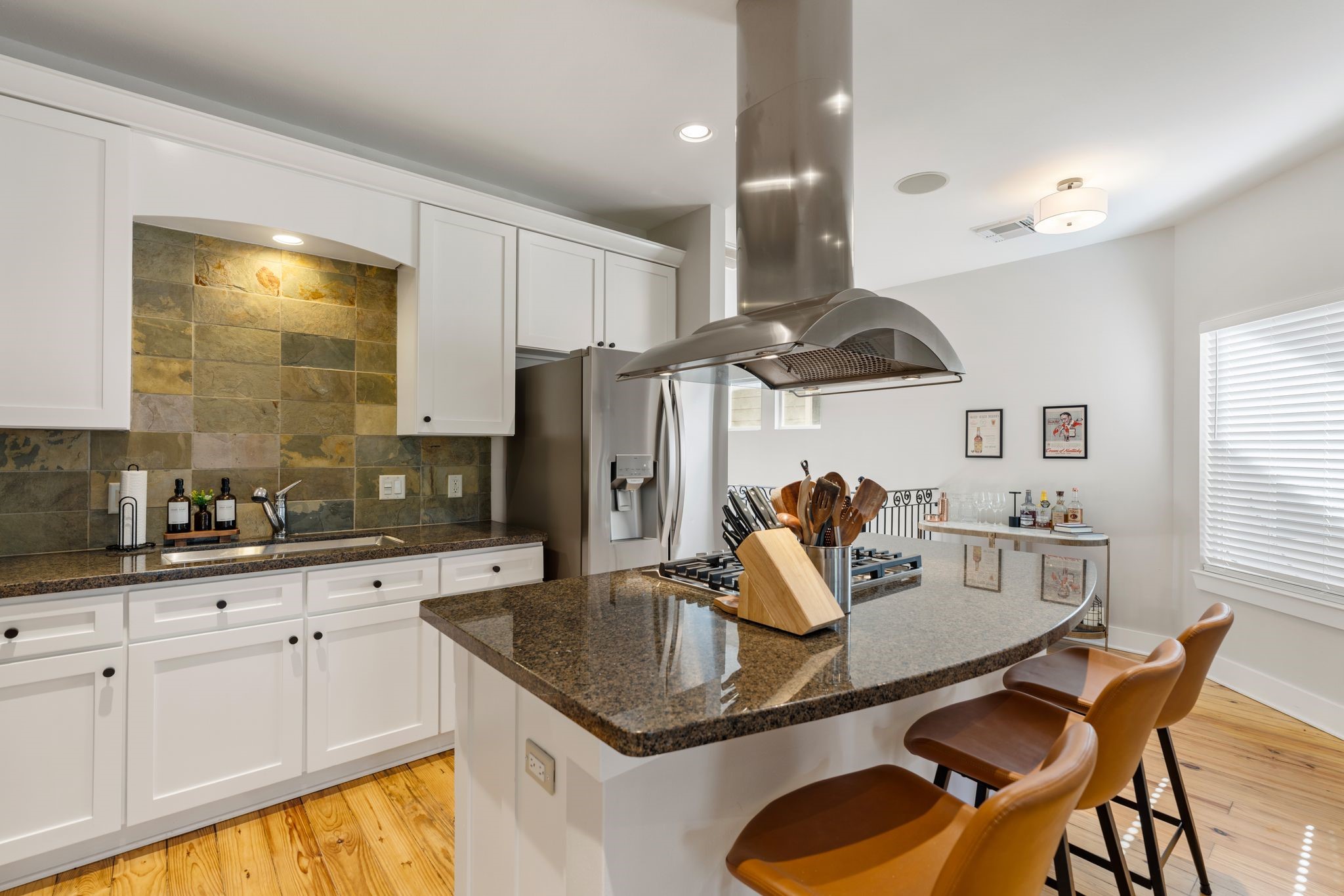1408 Asbury Street Houston, TX 77007 - Photo 12 of 24 a kitchen with granite countertop a table chairs stove a sink and dishwasher