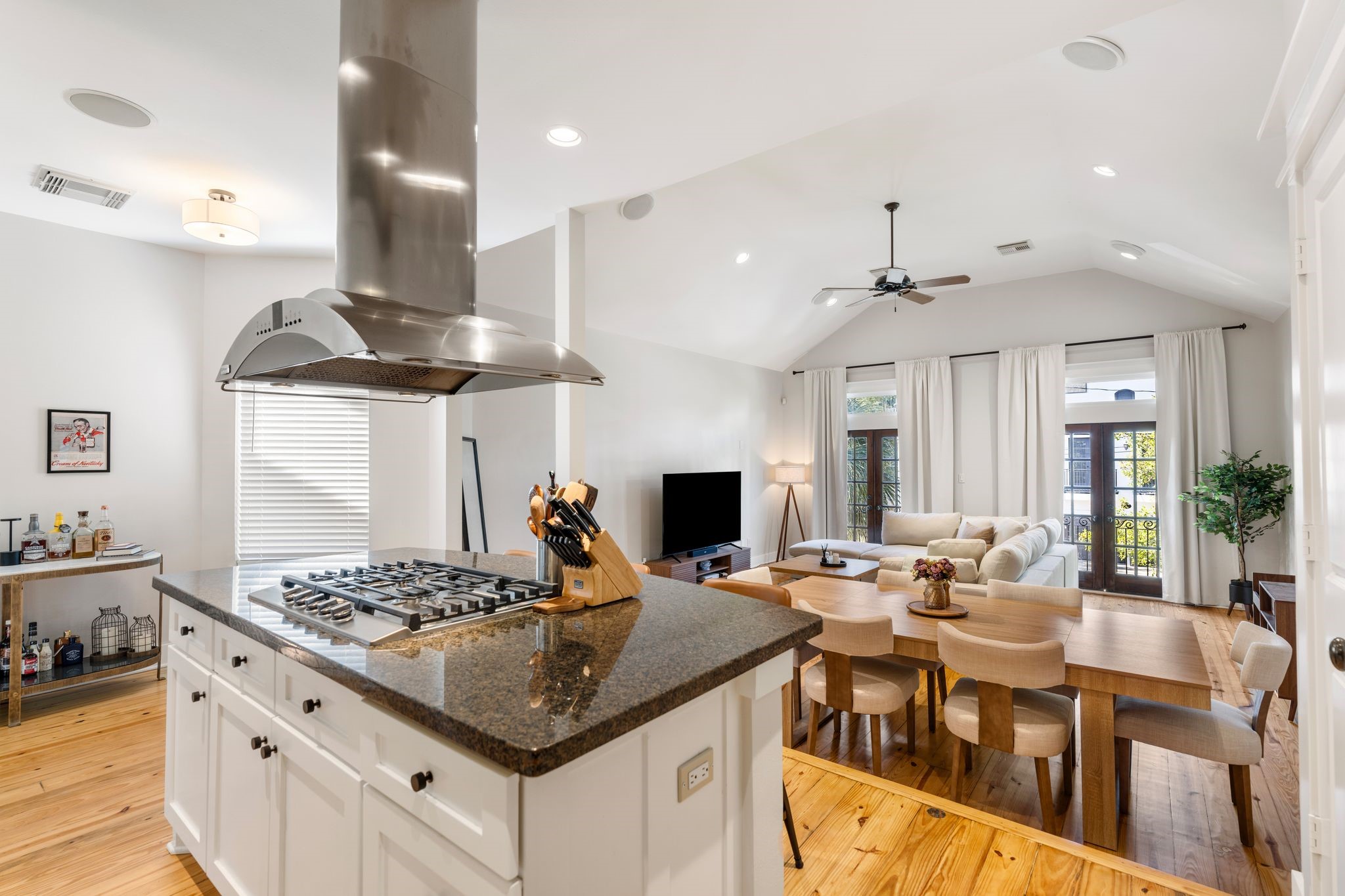 1408 Asbury Street Houston, TX 77007 - Photo 13 of 24 a kitchen with stainless steel appliances granite countertop a stove white cabinets a dining table and chairs