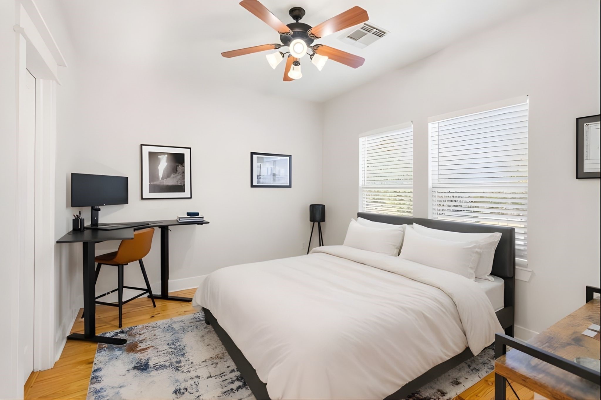 1408 Asbury Street Houston, TX 77007 - Photo 20 of 24 a bedroom with a bed and a table