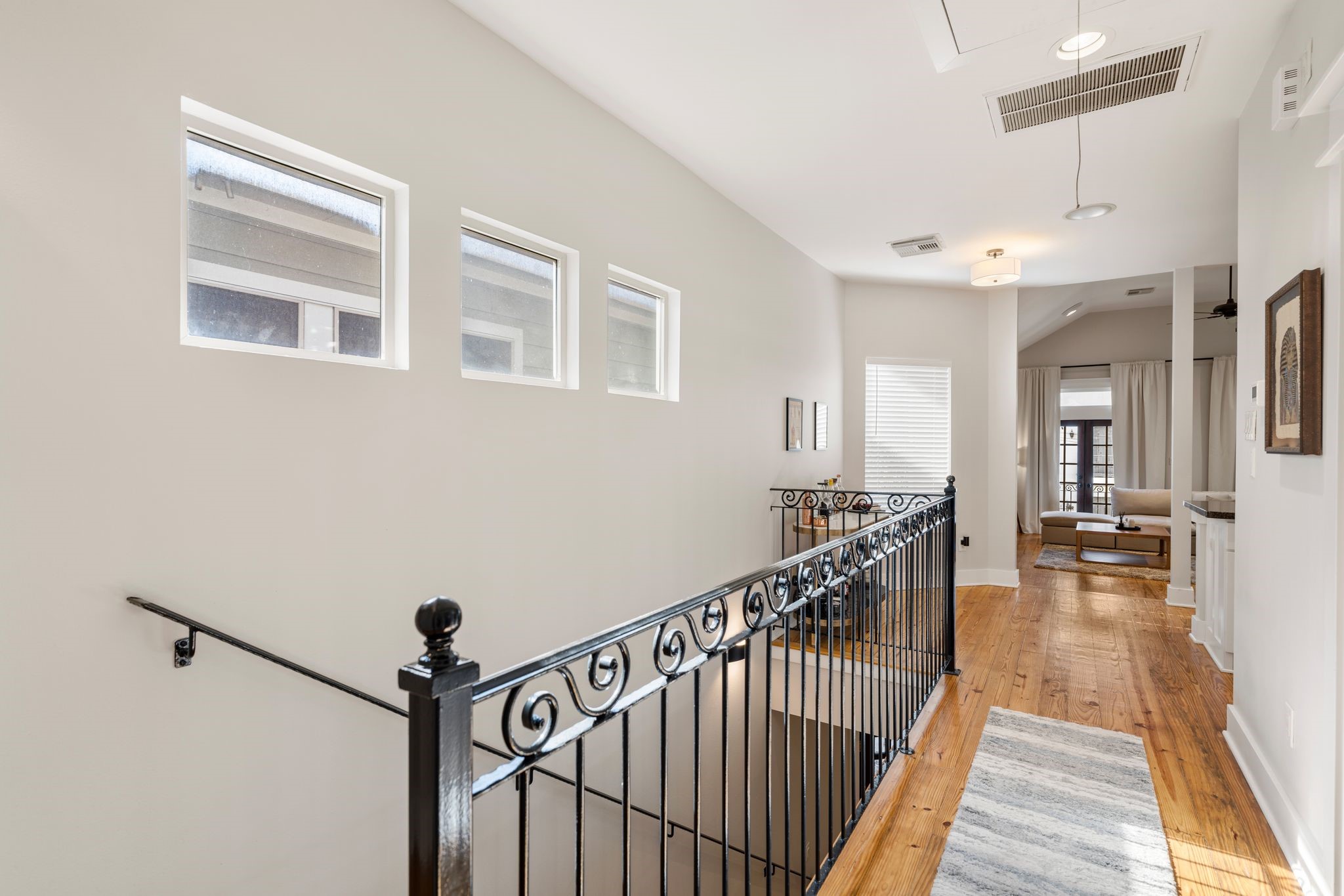 1408 Asbury Street Houston, TX 77007 - Photo 9 of 24 a view of entryway with dining room and wooden floor