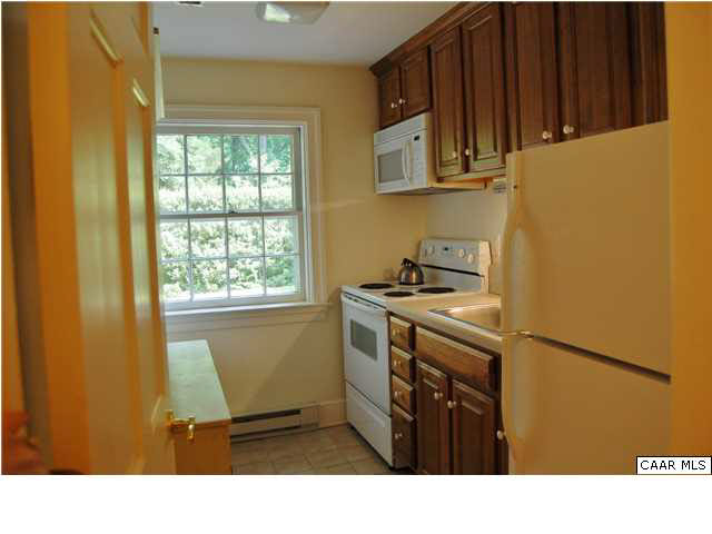 871 Tanglewood Road Charlottesville, VA 22901 - Photo 32 of 33 a kitchen with stainless steel appliances a stove a microwave and a refrigerator