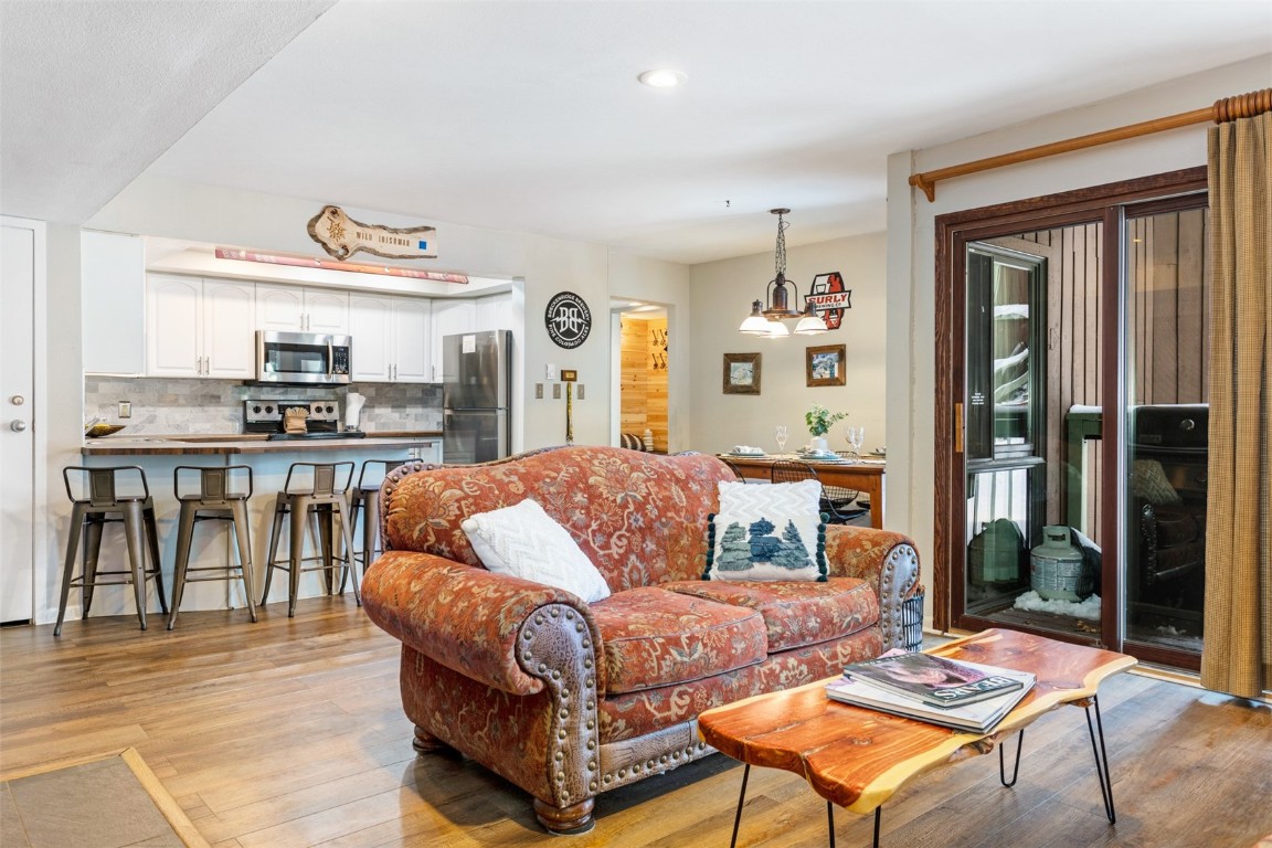 433 Wild Irishman Road, Unit 12101 Keystone, CO 80435 - Photo 15 of 20 a living room with furniture and a kitchen view