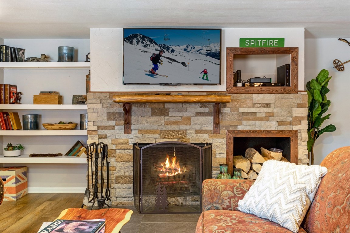 433 Wild Irishman Road, Unit 12101 Keystone, CO 80435 - Photo 16 of 20 a living room with furniture and a fireplace