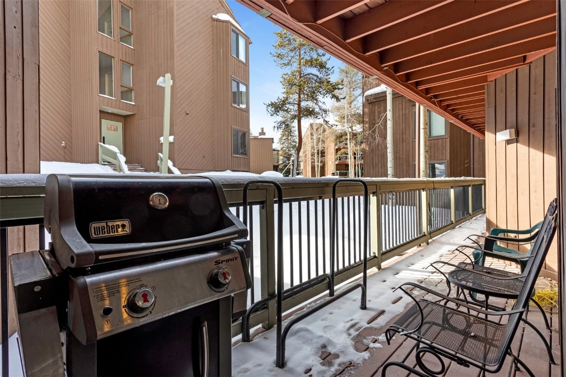 433 Wild Irishman Road, Unit 12101 Keystone, CO 80435 - Photo 17 of 20 a view of a chairs and table on the balcony