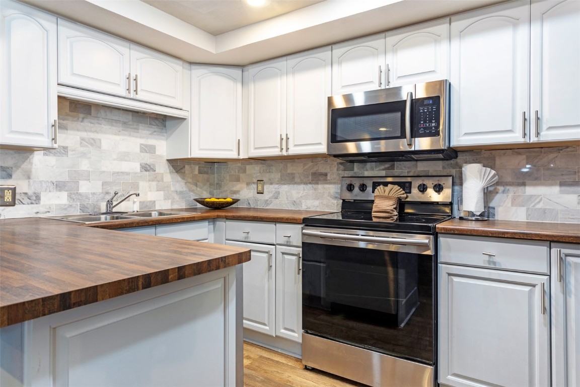 433 Wild Irishman Road, Unit 12101 Keystone, CO 80435 - Photo 2 of 20 a kitchen with stainless steel appliances granite countertop a sink stove and microwave