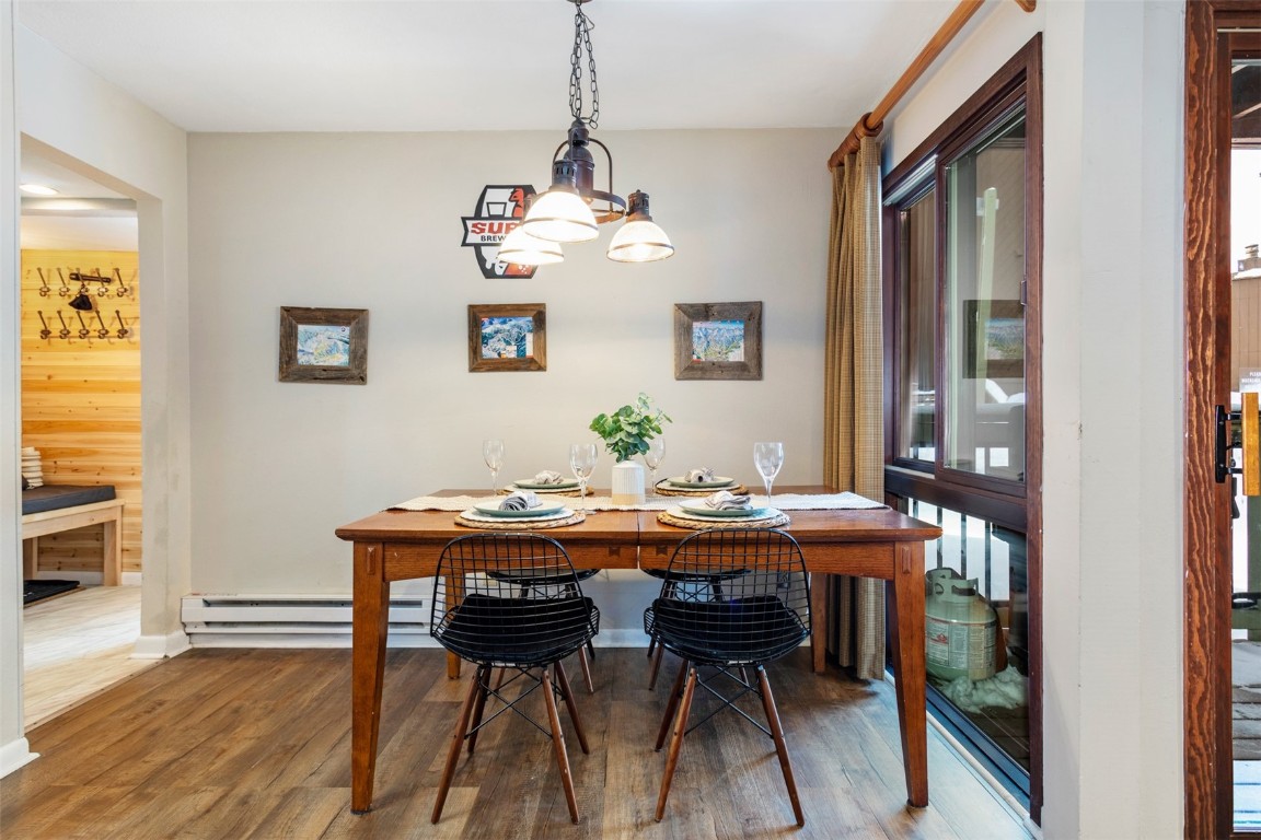 433 Wild Irishman Road, Unit 12101 Keystone, CO 80435 - Photo 4 of 20 a view of a dining room with furniture window and wooden floor
