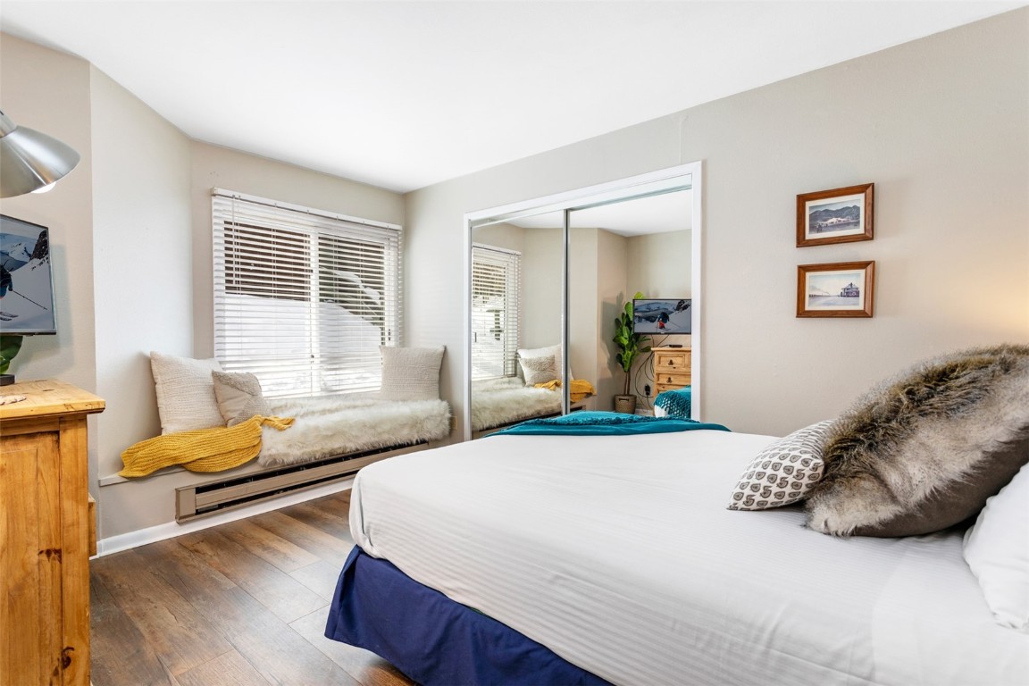 433 Wild Irishman Road, Unit 12101 Keystone, CO 80435 - Photo 6 of 20 a bedroom with a bed and wooden floor