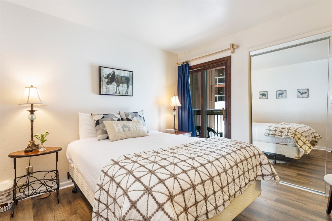 433 Wild Irishman Road, Unit 12101 Keystone, CO 80435 - Photo 8 of 20 a bedroom with a bed and wooden floor