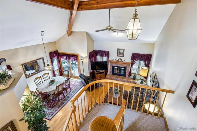 a view of a dining room with furniture wooden floor and chandelier