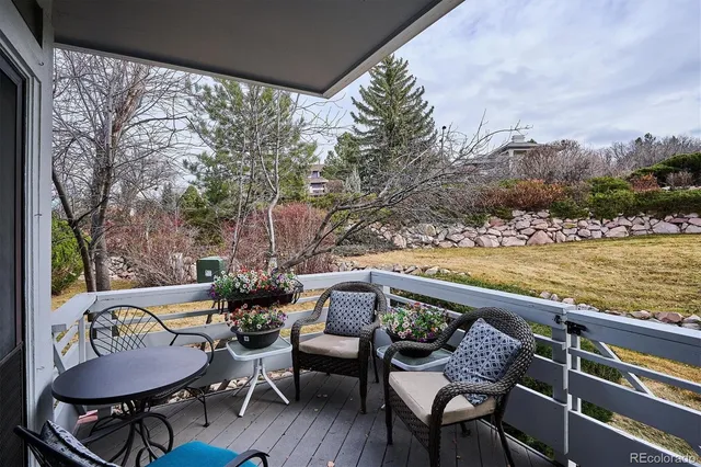 a view of a chairs and table in patio