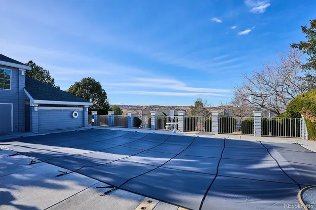a view of a house with wooden fence