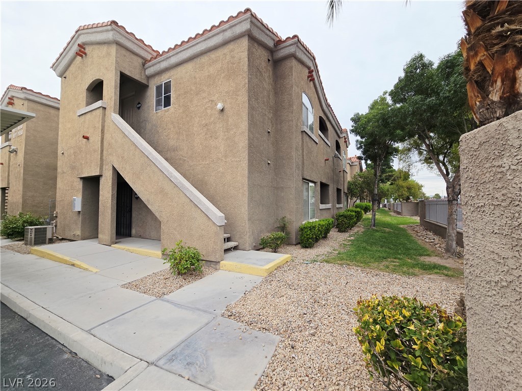 View of property with stairs