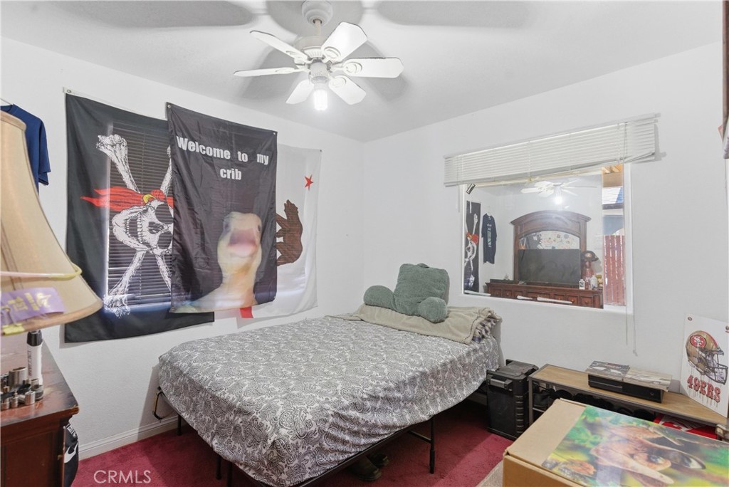 381 B Street Arvin, CA 93203 - Photo 15 of 23 a bedroom with a bed and window