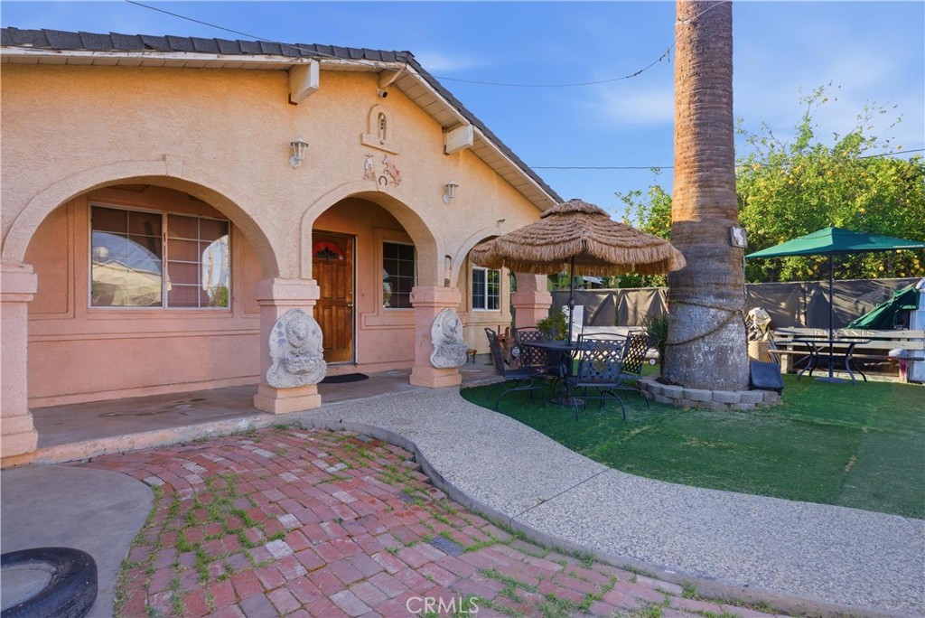 381 B Street Arvin, CA 93203 - Photo 2 of 23 a front view of a house with garden
