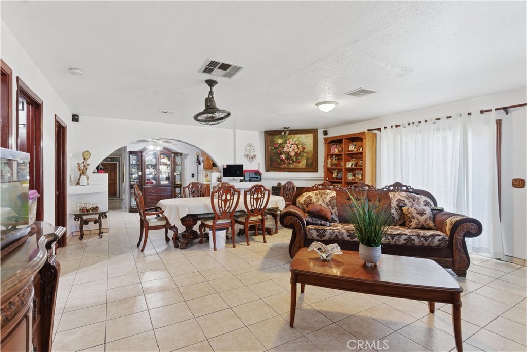 381 B Street Arvin, CA 93203 - Photo 3 of 23 a living room with furniture potted plant and a window