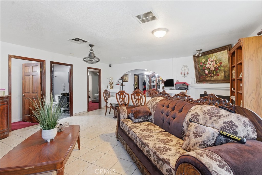 381 B Street Arvin, CA 93203 - Photo 4 of 23 a living room with furniture potted plant and flat screen tv