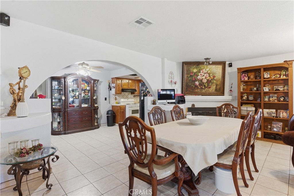 381 B Street Arvin, CA 93203 - Photo 5 of 23 a view of a dining room with furniture a rug and wooden floor