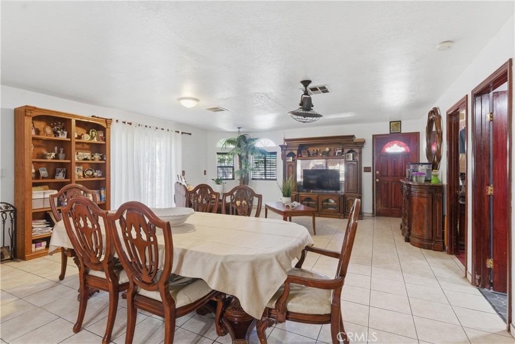 381 B Street Arvin, CA 93203 - Photo 6 of 23 a view of a dining room with furniture and chandelier